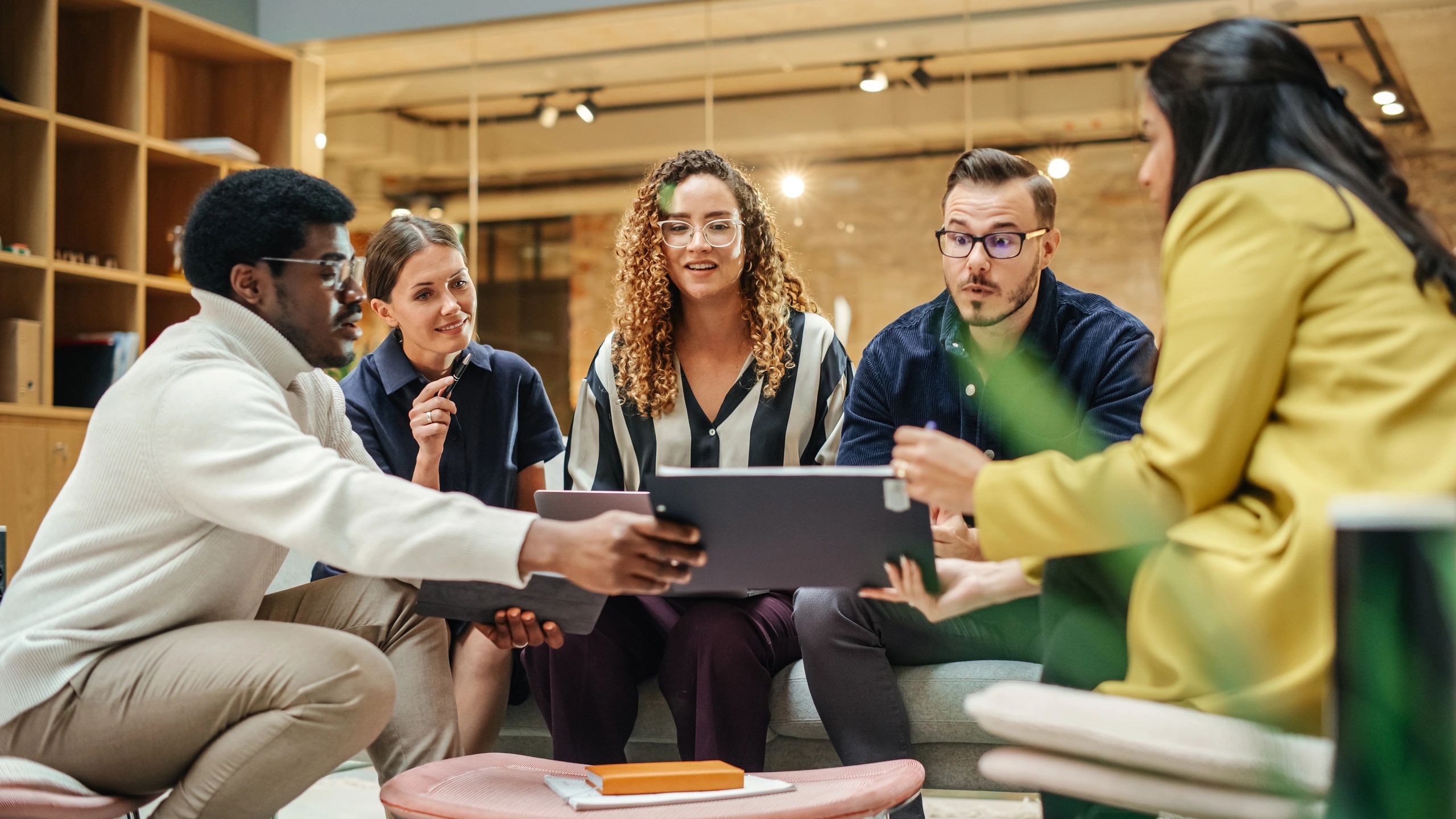 Technology consulting team collaborating in a modern office